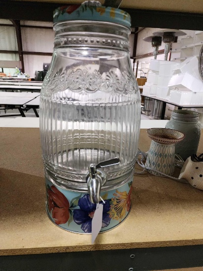 Glass drink dispenser with metal spigot and metal flower stand, Used.