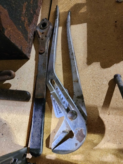 One large channel lock wrench and one scissor jack ratchet. Used.