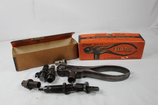 Lyman model 310, handloading press, with multiple dies for 30-06, 300 H&H. Used, in good condition.