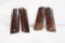 Two sets of polished wood 1911 grip panels.