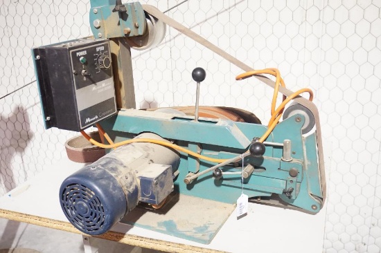 One Leeson 1.5 HP belt sander with Minarik Motor Master speed controller. With a number of 2" and 3"