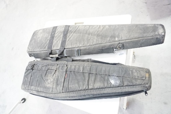 Two soft sided padded AR-15 rifle cases. Used.