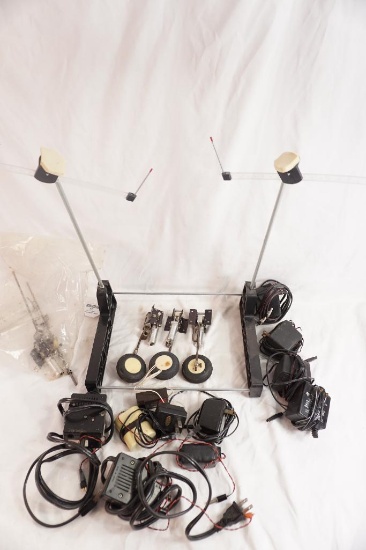 One Great planes C.G. center of gravity machine for RC airplanes, and numerous bags of batteries and