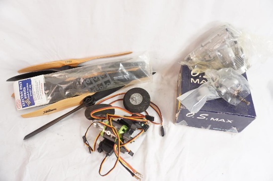 One O.S. Max RC piston engine, in box, one box of wood and plastic 13" RC plane props, count 12, and