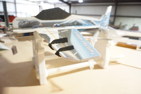 One styrofoam electric RC plane with stand. Will not ship, pick-up only.