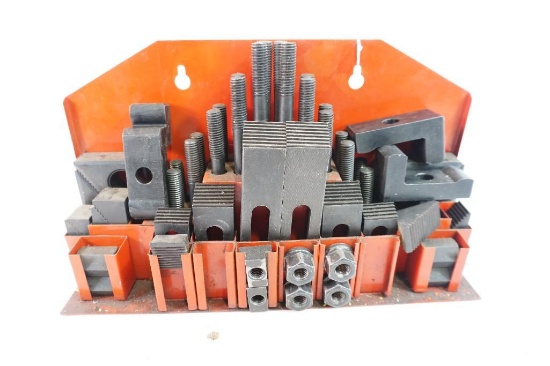 One larger machinists clamping kit set.