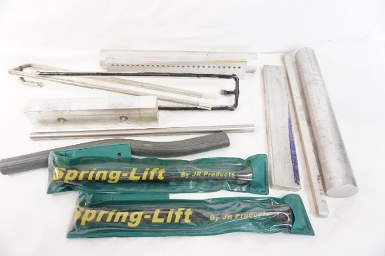 Miscellaneous aluminum plates, and round solid tubes, two spring lifts, etc.