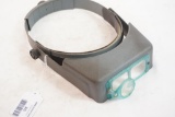 One Opti-Visor with jewelers loupe. Used.