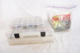 Three plastic parts trays with miscellaneous fishing items hooks, and worms, and one bag of plastic