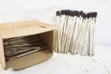 Box of small aluminum brushes.