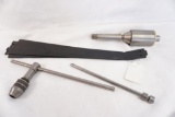 A JGS floating holder, large chuck key and four unknown metal possible shelves??
