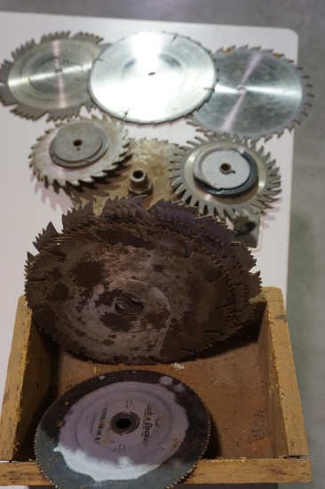 Wooden box with eleven used saw blades