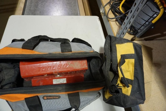One larger black and orange nylon tool bag, with two small red tool boxes, and one Dewalt nylon tool