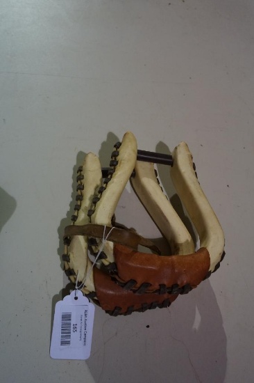 One pair of rawhide wrapped leather stirrups. Used.