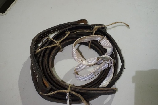One set of bridle reins and two chin straps. Used.