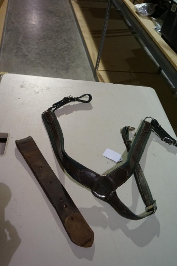 One leather horse collar and one leather cinch strap. Used.