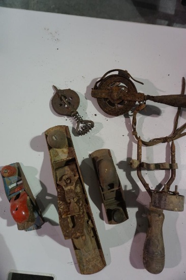 Old wood planes, old metal tape measure, etc.