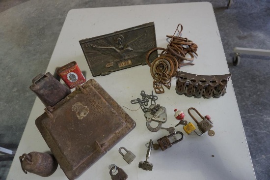 Stoking door for cast iron stove, cow bell, old coin changer, old lock, metal rings, etc.