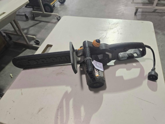 One WORK electric 14" chainsaw. Used.
