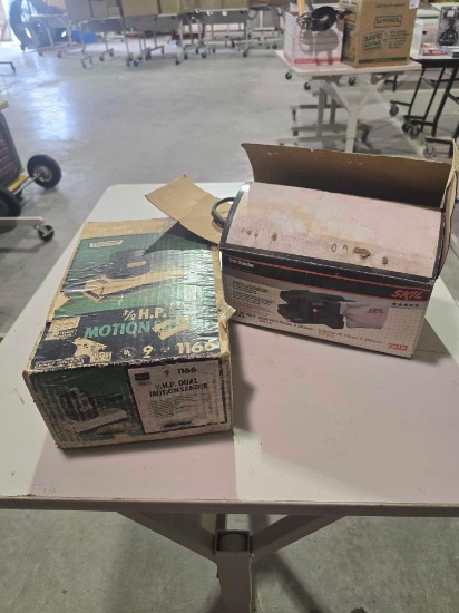 Two electric sanders. One Sears 1/2 hp motion sander, and one one SKIL 3/4 hp belt sander. Both in