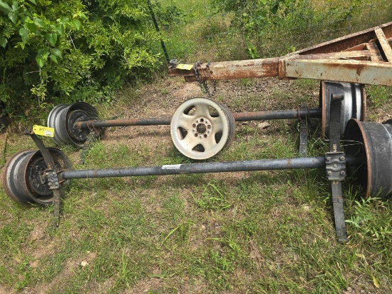 Pair of 5 lug axles with springs & 5 rims