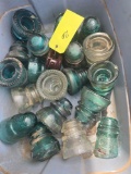 Tub of old glass insulators.