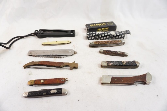 Twelve folding pocket knives