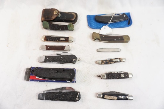 Twelve folding pocket knives