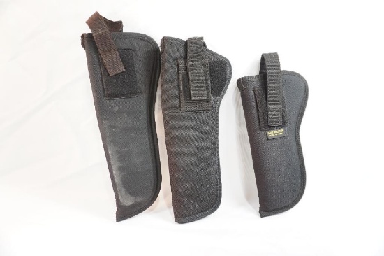 Three black nylon gun holsters