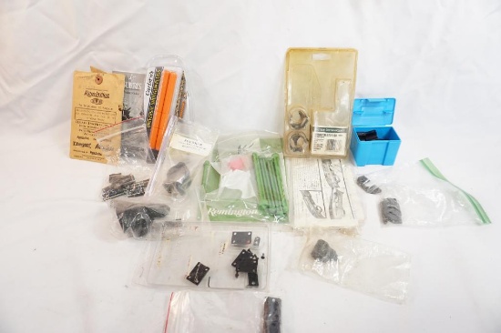 Box of miscellaneous items including shotgun plugs, scope rings and bases