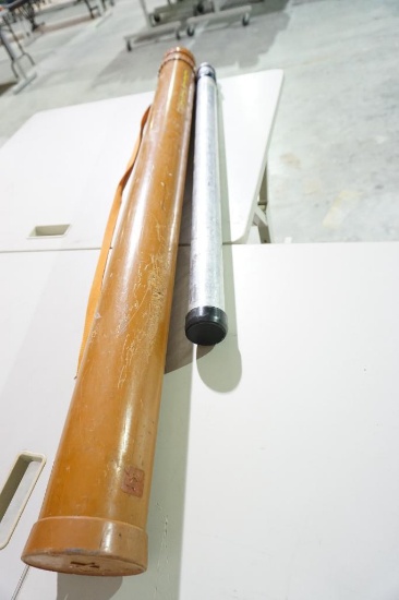 Two fishing pole carry cases, one plastic Flambeau and one metal telescoping