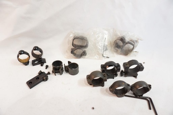 Four sets of scope rings, one with bases