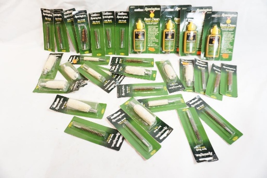 Bag of gun cleaning supplies including bore cleaner, brushes and mops