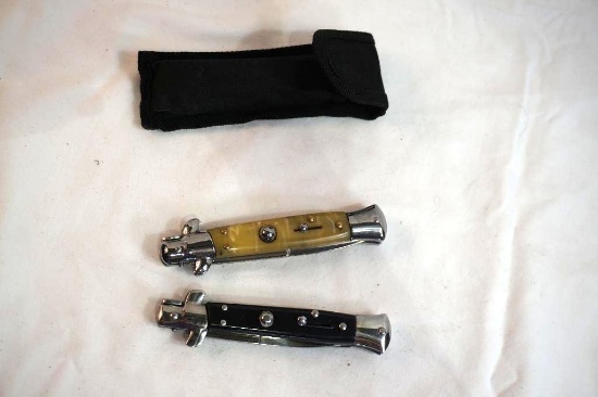 Two switchblade knives, and one nylon belt knife sheath.