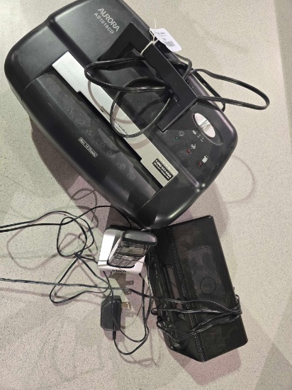 One Aurora paper shredder, digital alarm clock, and one vtech portable phone.
