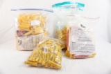 Four bags of Activ yellow 20 gauge shell hulls new in pkg and one bag of Activ fired hulls for