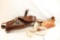 Two leather over the shoulder gun holsters
