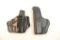 Two leather right handed holsters. One belt and one belt clip.