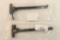 Two AR-15 charging handles.
