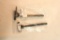 Two AR-15 charging handles.