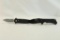 Two Elite Tactical belt clip assisted opening knives. In boxes.