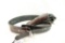 One black leather western style revolver holster and cartridge belt.