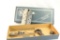 Smith & Wesson pistol box containing two Colt .45 Auto magazines, 3 recoil springs and other misc