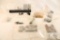 Bag containing an A2 buffer tube, muzzle break, unknown trigger assemblies, and other gun parts
