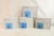 Four sets of Plantronics SupraPlus phone headsets in boxes used