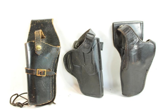 Three black leather holsters
