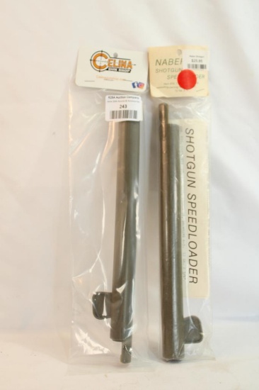 Two shotgun speed loaders, in packages.