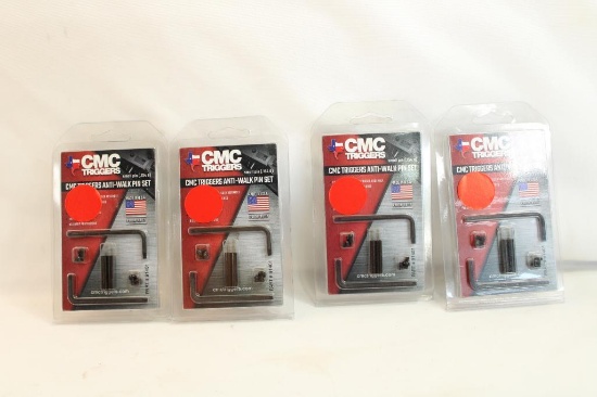 Three CMC trigger anti-walking pin sets. In packages.