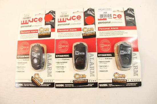 Three Mace keychain personal protection alarms, in packages.