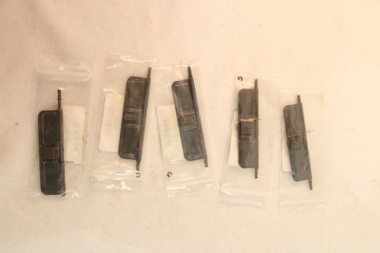 Five AR-15 dust covers. In packages.